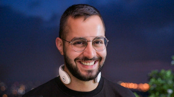 Man smiling while wearing the Necklux
